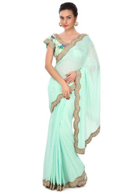 Moonlight jade green saree enahcned in kundan embroidered border only on Kalki