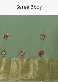 Pista Green Saree In Organza With Hand Embroidered Floral Buttis Using Thread And French Knots