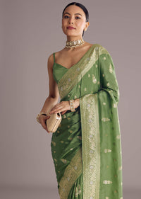 Pista Green Saree With Zari Weave And Stone Embellishments