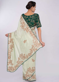 Pista green satin saree with emerald green silk blouse with cut dana embroidery only on kalki