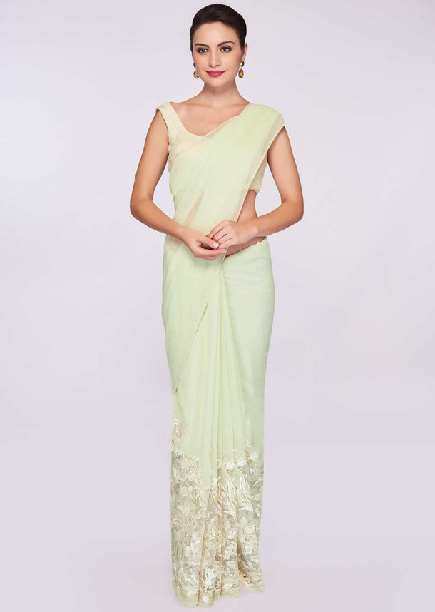 Pista green shaded georgette saree with net embroidered bottom