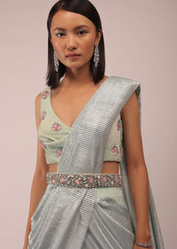 Pista Green Ready Pleated Saree With Shimmer Crepe Frill Layers And Pink Stone Studded Velvet Blouse