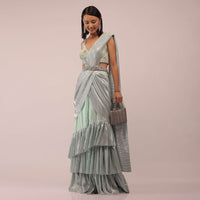 Pista Green Ready Pleated Saree With Shimmer Crepe Frill Layers And Pink Stone Studded Velvet Blouse