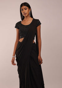 Pitch Black Saree With Three Tones Of Layered Frills On The Bottom Embellished In Stones And Sequins With A Tassel On The Pallu Corner