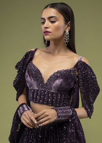 Plum Violet Lehenga And Crop Top In Velvet, Paired With A Cape Crafted In Net With Cuffs At The Border