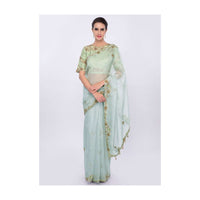 Powder blue organza saree with  contrasting pista green raw silk blouse only on kalki