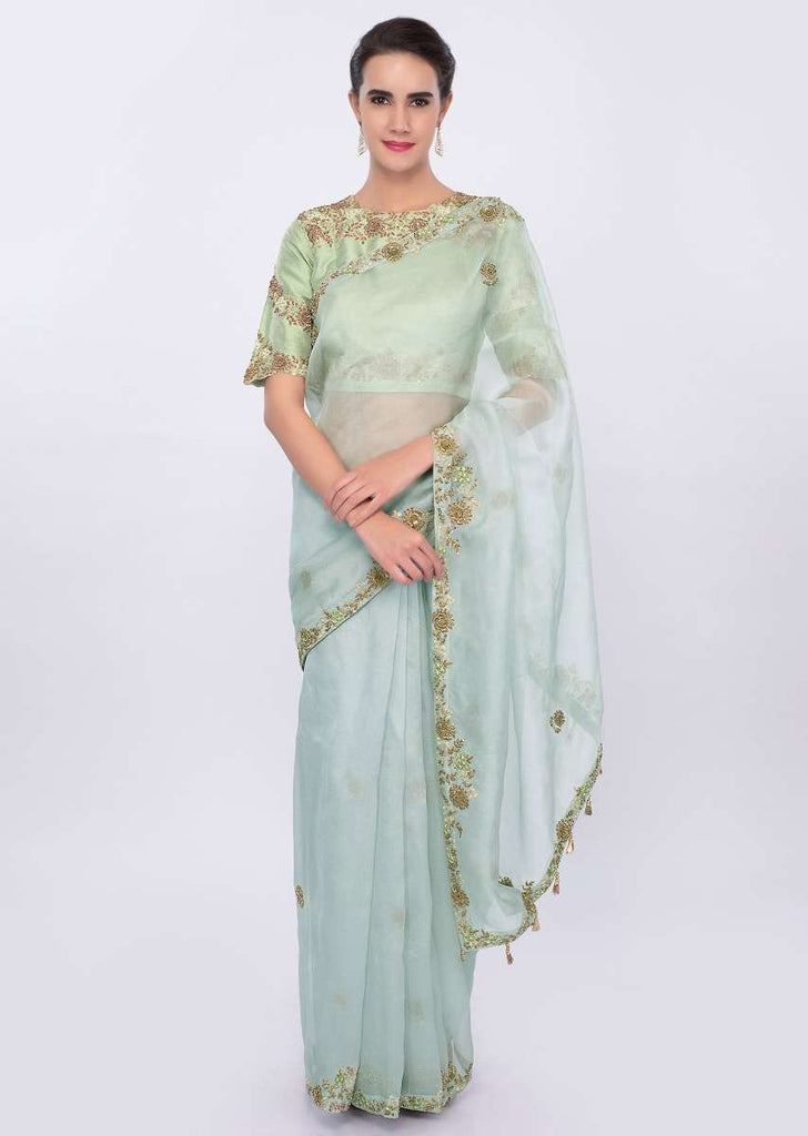 Powder blue organza saree with  contrasting pista green raw silk blouse only on kalki