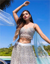 Megha Bajaj In Kalki Powder blue scallop embroidered net lehenga with matching net blouse with fancy attached blouse only on Kalki