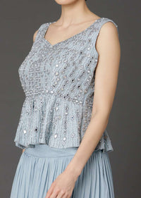 Powder Blue Sleeveless Peplum Top And Matching Skirt With Cowl Drape Online - Kalki Fashion