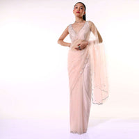 Powder Peach Saree In Net With Mirror Embroidered Scallop Cut Border And Ready Stitched Blouse