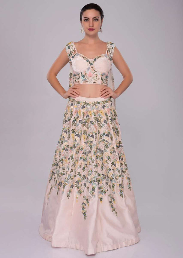 Powder pink hand and machine embroidered lehenga and corset with shoulder cape 