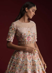 Powder Pink Lehenga Choli In Raw Silk With Hand Embroidered Floral Kalis Using Colorful Resham And Flower Sequins Online - Kalki Fashion