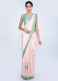 Powder pink silk saree with floral embroidered butti and border only on kalki