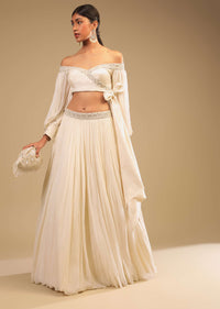 Powder White Lehenga And Off Shoulder Crop Top With Bishop Sleeves, Hand Embroidery And An Elaborate Bow