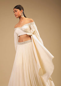 Powder White Lehenga And Off Shoulder Crop Top With Bishop Sleeves, Hand Embroidery And An Elaborate Bow