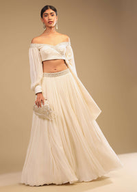 Powder White Lehenga And Off Shoulder Crop Top With Bishop Sleeves, Hand Embroidery And An Elaborate Bow