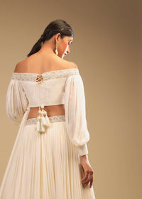 Powder White Lehenga And Off Shoulder Crop Top With Bishop Sleeves, Hand Embroidery And An Elaborate Bow