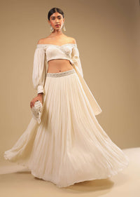 Powder White Lehenga And Off Shoulder Crop Top With Bishop Sleeves, Hand Embroidery And An Elaborate Bow