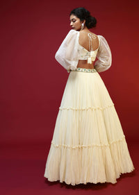 Powder White Lehenga Choli With Elaborate Balloon Sleeves And Multi Colored Hand Embroidered Buttis