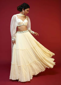 Powder White Lehenga Choli With Elaborate Balloon Sleeves And Multi Colored Hand Embroidered Buttis