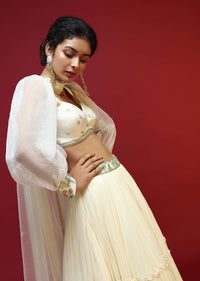 Powder White Lehenga Choli With Elaborate Balloon Sleeves And Multi Colored Hand Embroidered Buttis