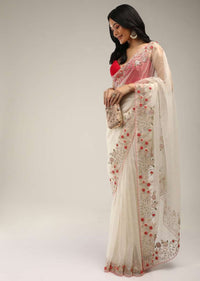 Powder White Saree In Organza With Colorful Resham Flowers On The Border Along With Moti And Cut Dana Accents