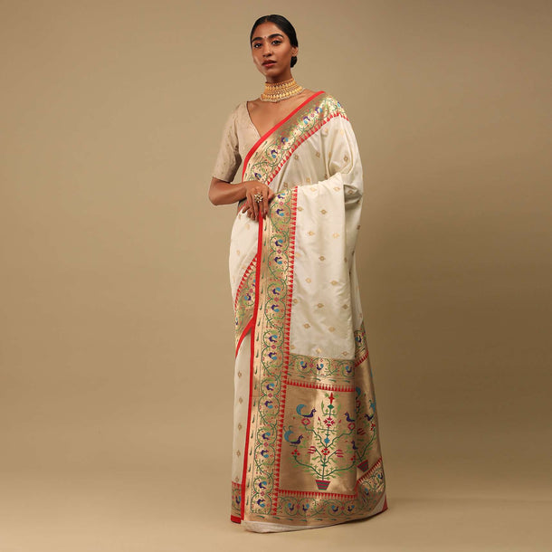 Powder White Saree In Art Handloom Silk With Woven Geometric Buttis, Peacock Motifs On The Border And Unstitched Blouse