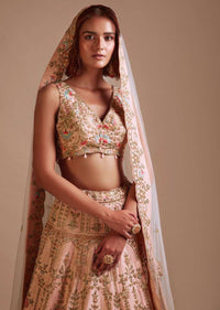 Powder Pink Lehenga Choli With Hand Embossed Embroidery Detailing In Ornate Floral Kalis And Mughal Motifs