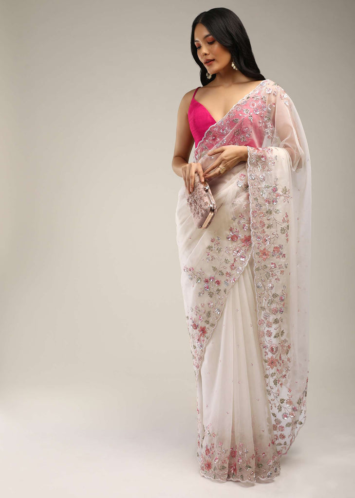 Powder White Saree In Organza With Multi Colored Sequins And Pita Zari Embroidered Floral Motifs On The Border