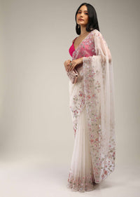 Powder White Saree In Organza With Multi Colored Sequins And Pita Zari Embroidered Floral Motifs On The Border