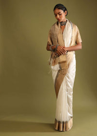 Powder White Saree In Tussar Silk With A Contrasting Woven Golden Border And Textured Tussar Detailing On The Pallu