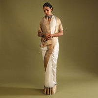 Powder White Saree In Tussar Silk With A Contrasting Woven Golden Border And Textured Tussar Detailing On The Pallu