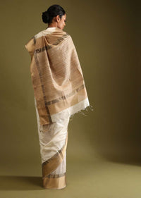 Powder White Saree In Tussar Silk With A Contrasting Woven Golden Border And Textured Tussar Detailing On The Pallu