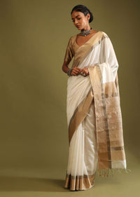 Powder White Saree In Tussar Silk With A Contrasting Woven Golden Border And Textured Tussar Detailing On The Pallu