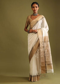 Powder White Saree In Tussar Silk With A Contrasting Woven Golden Border And Textured Tussar Detailing On The Pallu