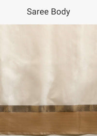 Powder White Saree In Tussar Silk With A Contrasting Woven Golden Border And Textured Tussar Detailing On The Pallu