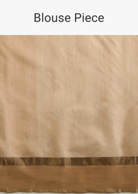 Powder White Saree In Tussar Silk With A Contrasting Woven Golden Border And Textured Tussar Detailing On The Pallu
