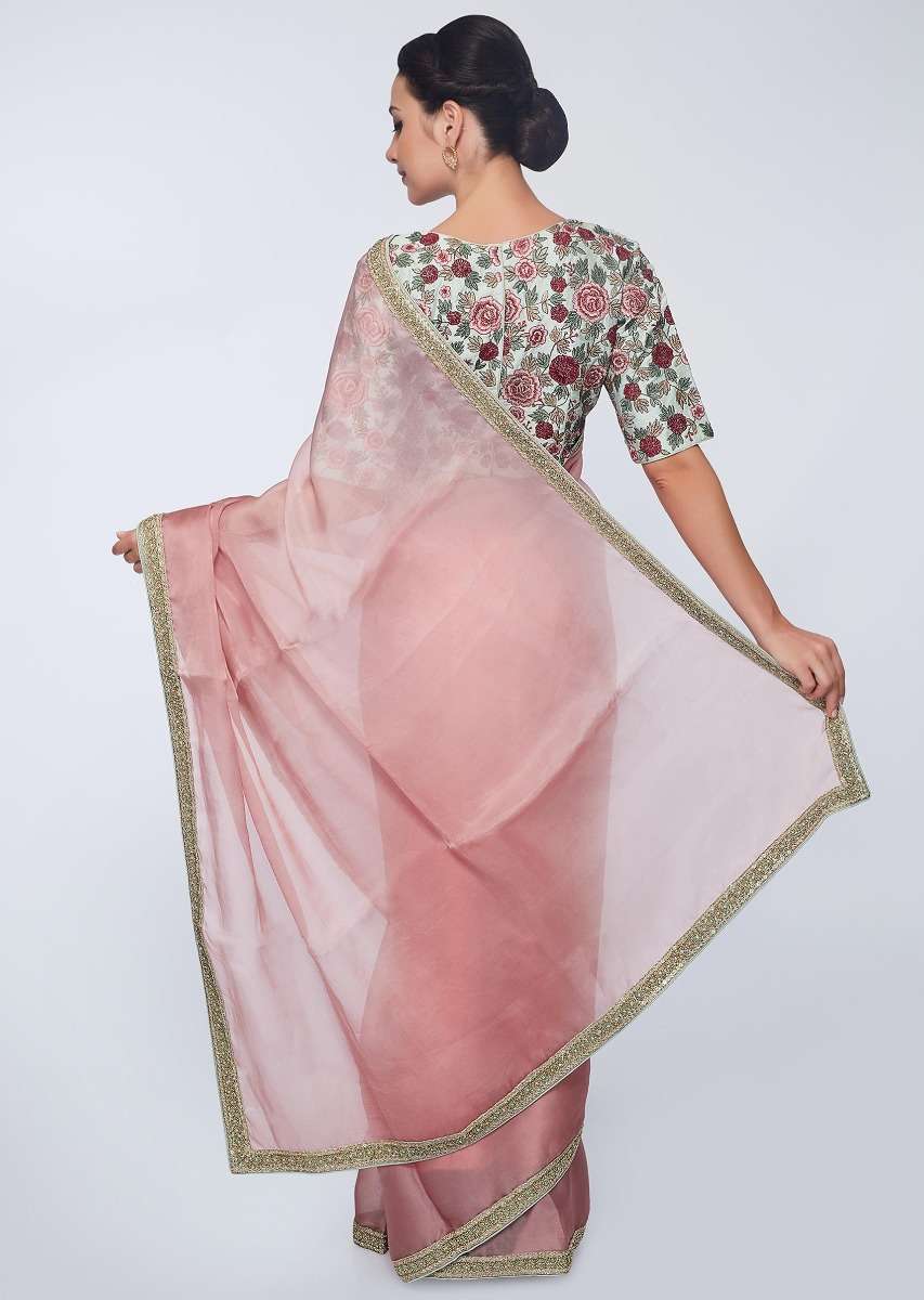 Punch pink organza saree with heavy embroidered border