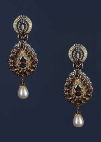 Purple Crystal Studded Drop Shaped Danglers With Stones And Dangling Pearl Online - Kalki Fashion