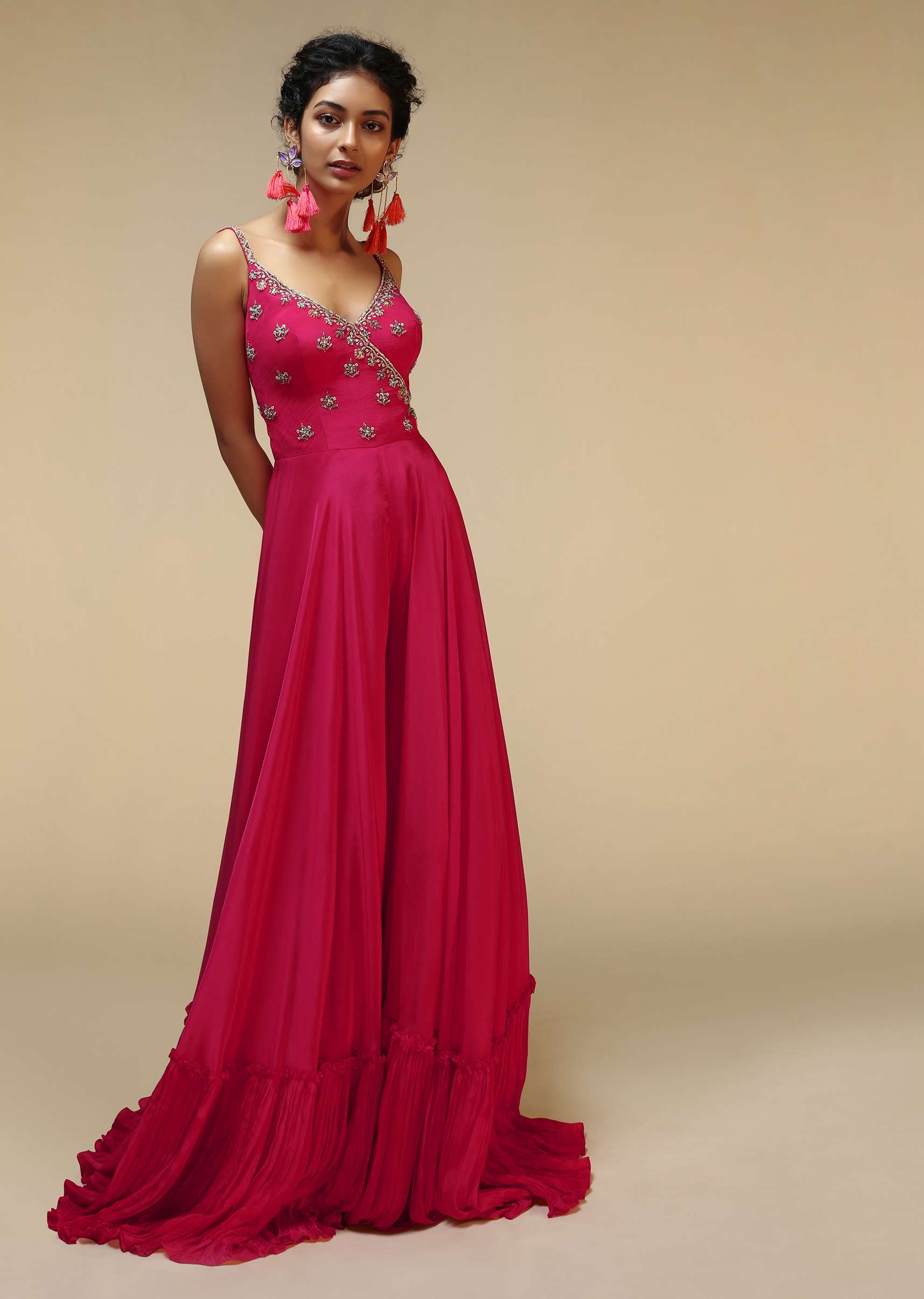 Rani Pink Jumpsuit With An Overlapping Neckline Adorned In Hand Embroidered Buttis Using Cut Dana And Sequins