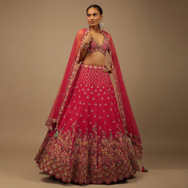 Rani Pink Lehenga Choli In Raw Silk With A Cluster Of Multi Colored Resham Flowers And Cut Dana Highlights