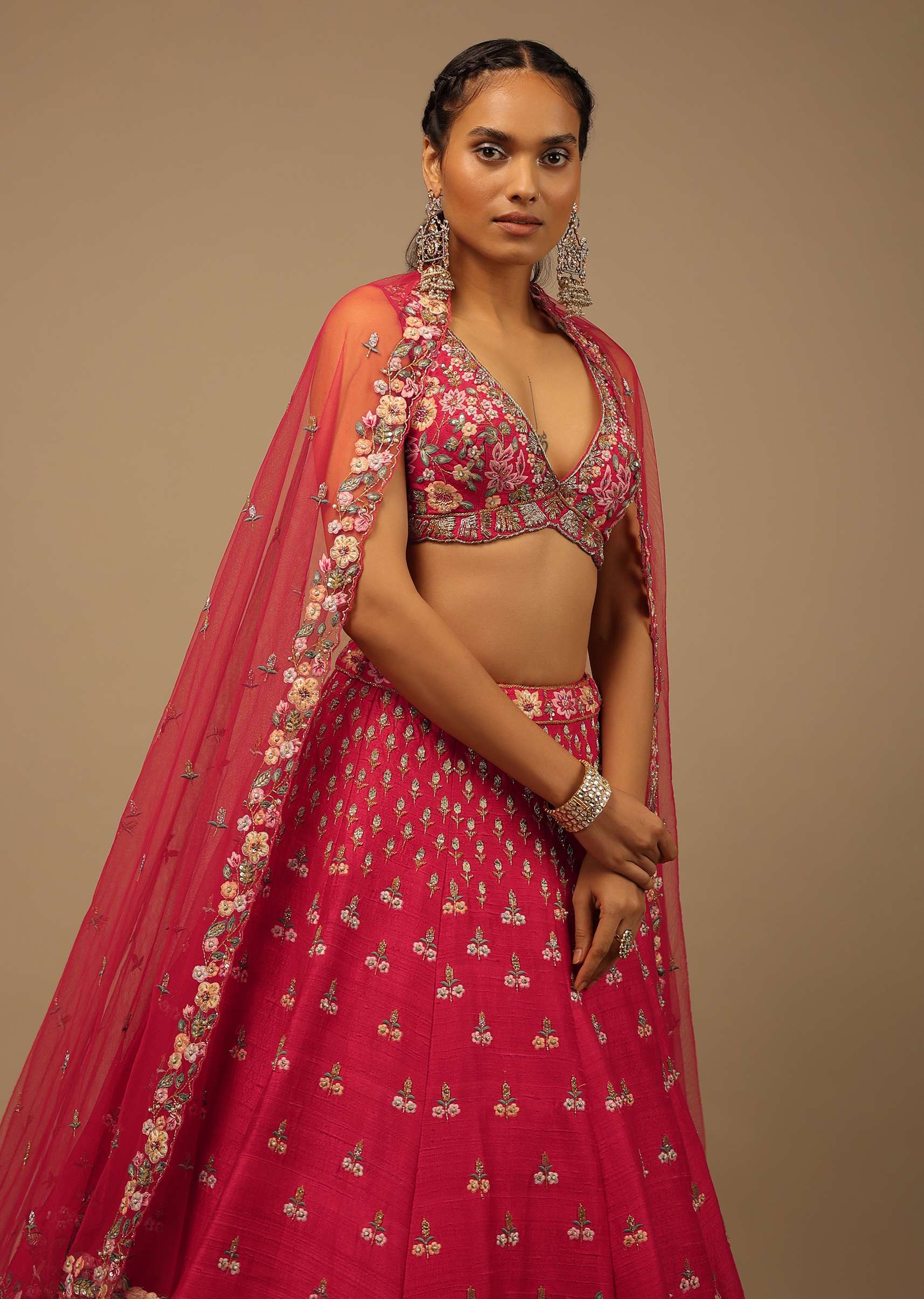 Rani Pink Lehenga Choli In Raw Silk With A Cluster Of Multi Colored Resham Flowers And Cut Dana Highlights