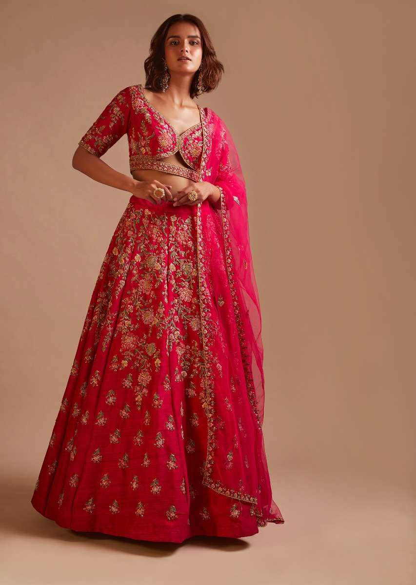 Rani Pink Lehenga Choli In Raw Silk With Hand Embroidered Cluster Of Flowers Cascading Into Floral Buttis