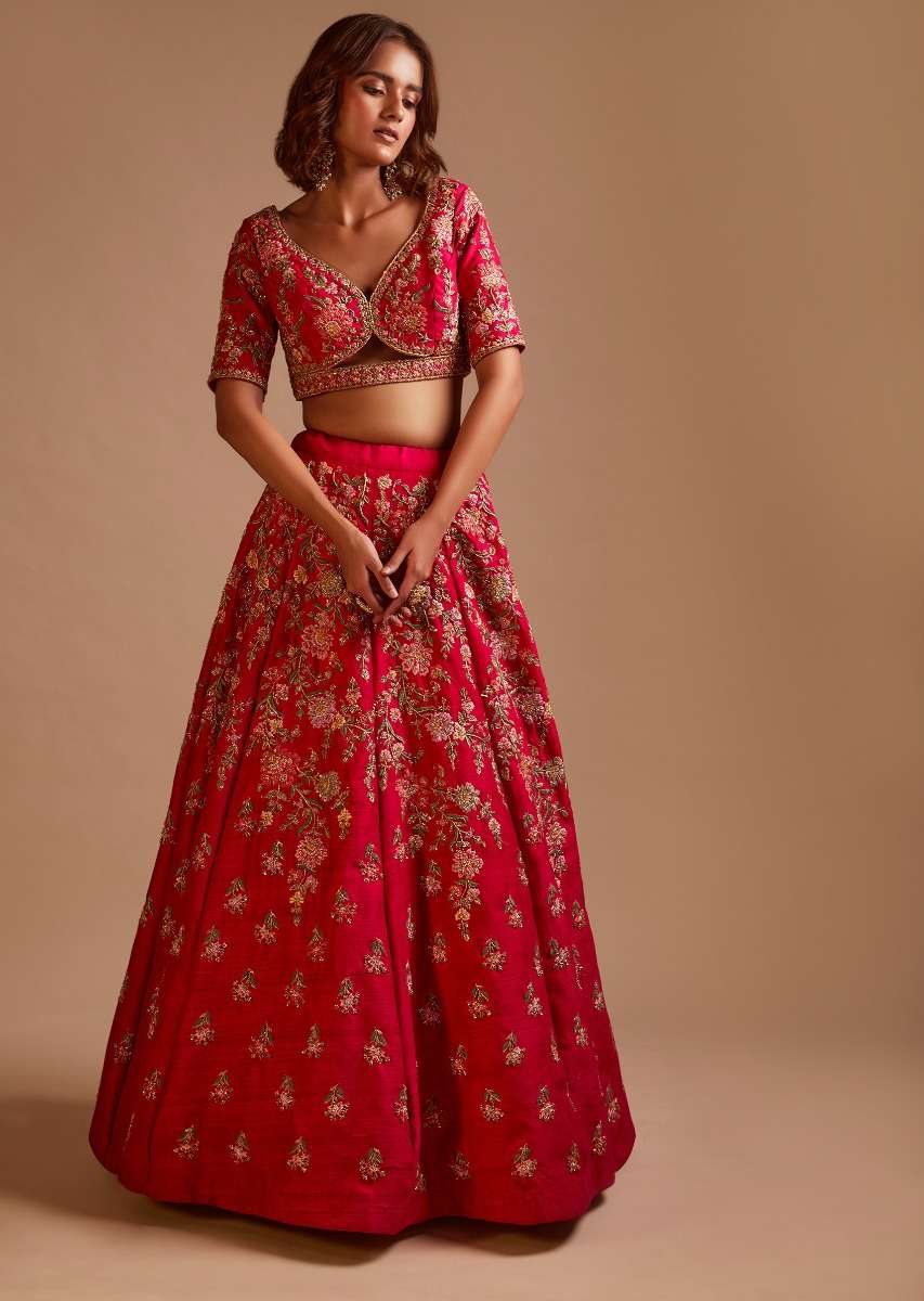 Rani Pink Lehenga Choli In Raw Silk With Hand Embroidered Cluster Of Flowers Cascading Into Floral Buttis