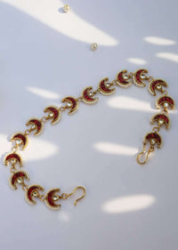 Red And Gold Headband With Uncut Polki, Ruby And Moti Arranged In Crescent Motifs That Have A Timeless Classic Look By Paisley Pop