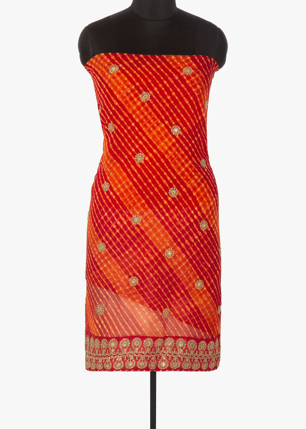 Red and orange unstitched suit in leheriya cotton with zari and sequin butti only on Kalki