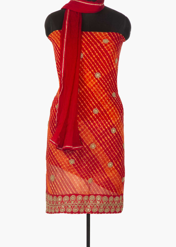 Red and orange unstitched suit in leheriya cotton with zari and sequin butti only on Kalki