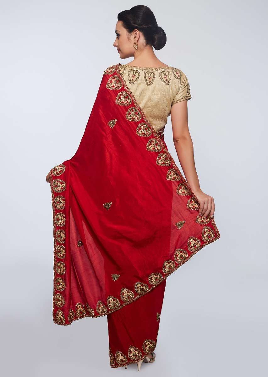 Red cotton silk saree in embroidered butti and border