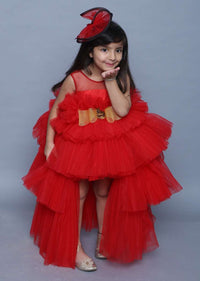 Red Gown In Net With High Low Ruffle Layers And Golden Bow On The Waist Online - Kalki Fashion