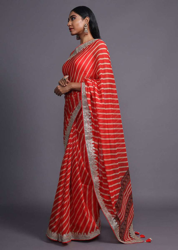 Red Saree With Lehariya Print And Paisley Motifs On The Pallu Along With Gotta Border